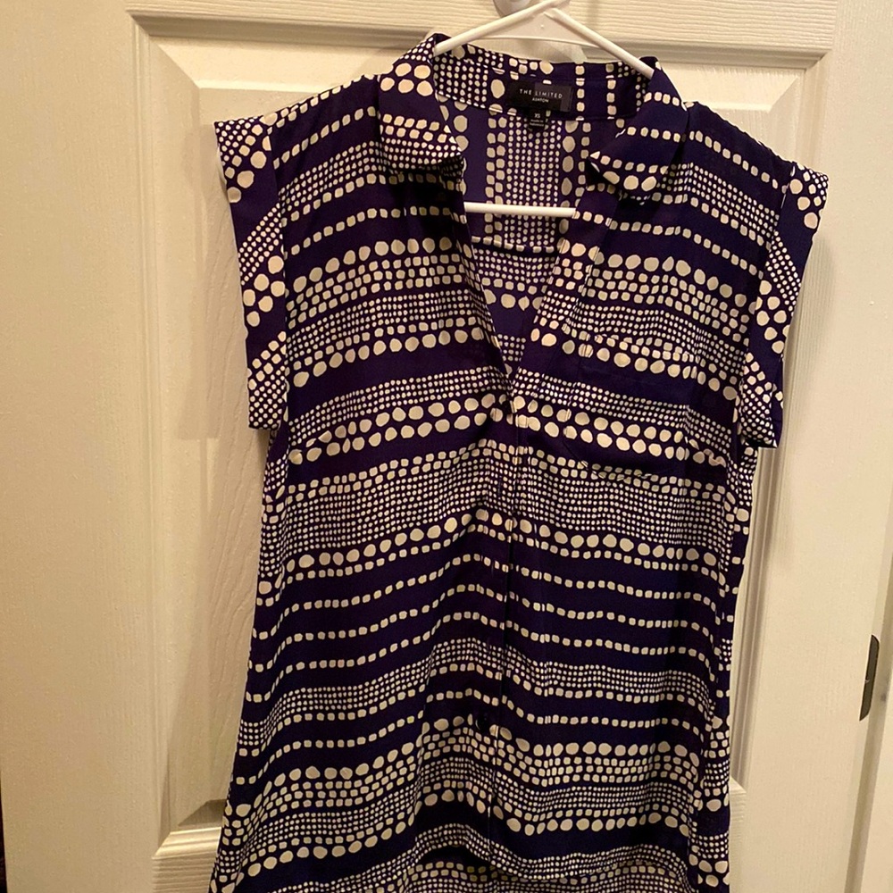 Navy Blue and Cream colored cap sleeve blouse.